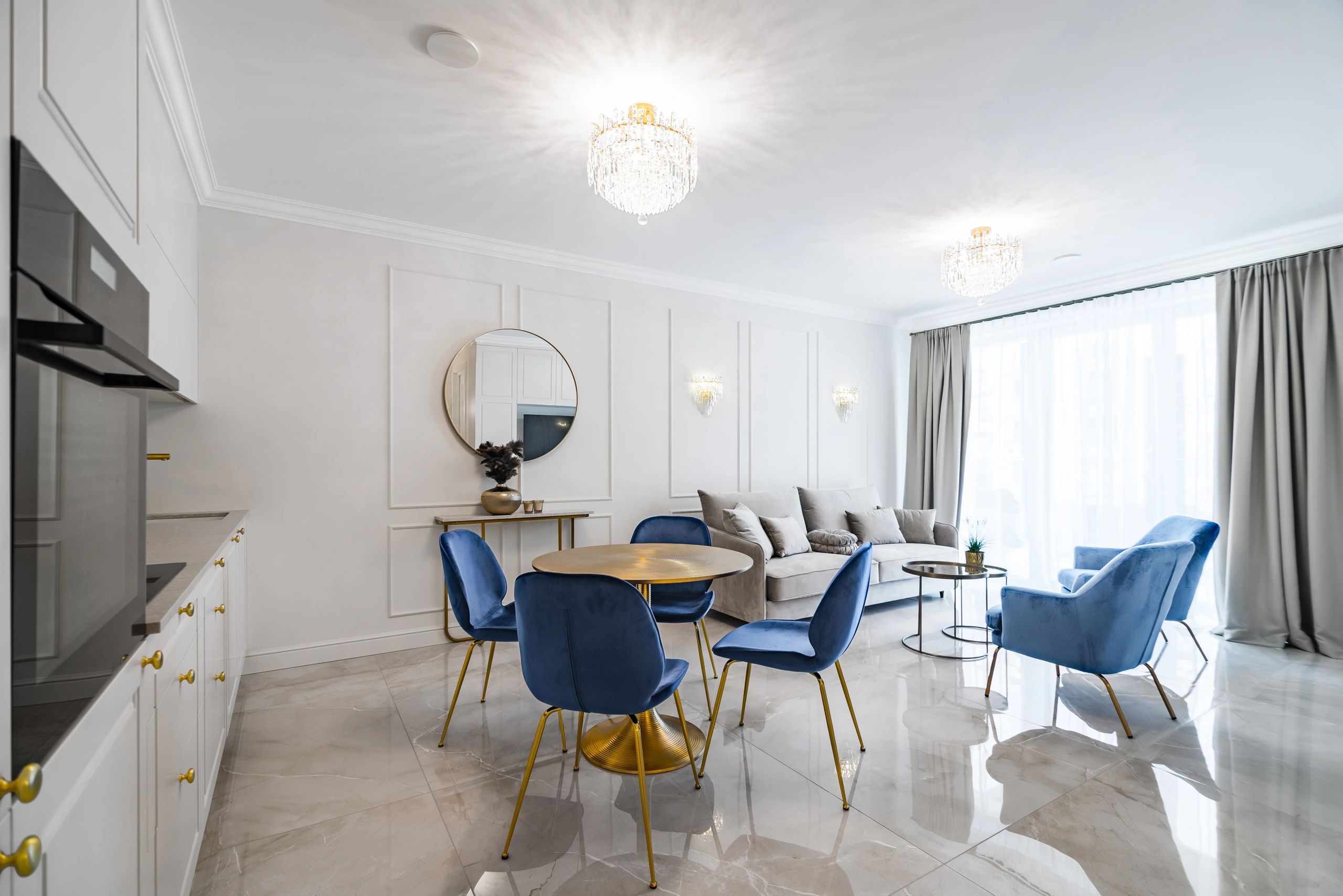 Open-plan living space with clean, bright painted walls